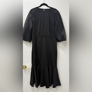 Elegant Black Dress with Sheer Sleeves